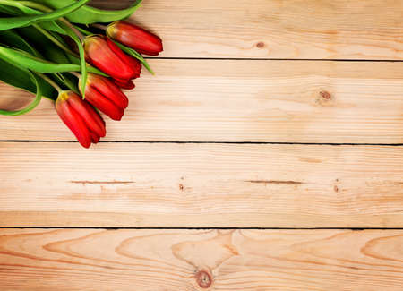 Vintage Wooden Background with Tulip Flowersの写真素材