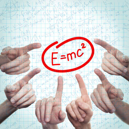 Science or Education Background with Hand and Formulas on Student Pageの写真素材