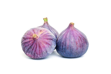 Purple Figs Fruit and Green Leaves. Organic Food on White Backgroundの写真素材