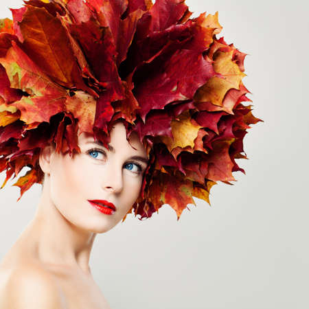 Autumn Beauty. Perfect Woman with Fall Leaves Wreathの写真素材