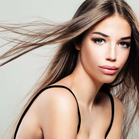 Beautiful Young Woman with Makeup and Long Brown Hairの写真素材
