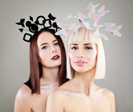 Two Beautiful Women Fashion Models with Fashion Hairstyle, Makeup and Hair Decorationsの写真素材
