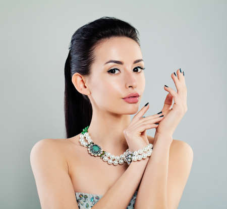 Beautiful Woman with Makeup and Pearls Jewelryの写真素材