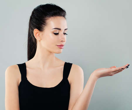 Beautiful Fashion Model Woman Showing Empty copy spaceの写真素材