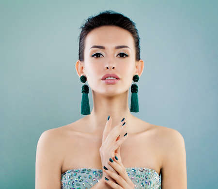 Fashion Beauty Portrait of Cute Young Woman with Earrings. Beautiful Fashion Modelの写真素材