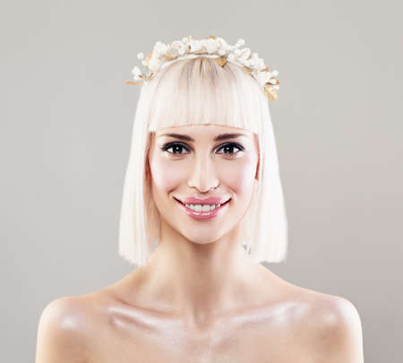 Beautiful Young Woman Bride with Blonde Bob Hairdo, Makeup and White Flower Hairdecorの写真素材
