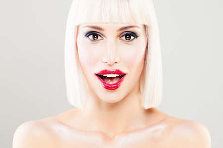 Surprised Woman with Open Mouth. Blondie Model with Makeup and Bob Hairstyle. Surprised Face Closeupの写真素材