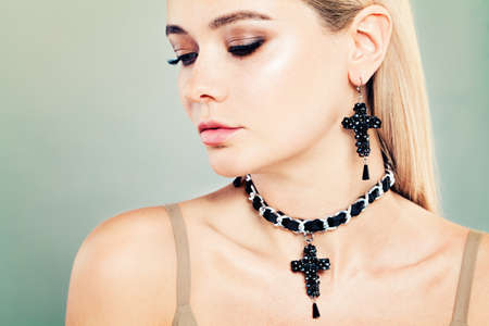 Blonde Woman with Jewelry and Makeup. Face Closeupの写真素材
