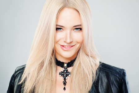 Beautiful Blonde Woman with Blonde Hair and Gothic Jewelry Necklaces. Blondie Fashion Model with Shiny Hairstyle and Natural Makeupの写真素材