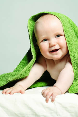 Cute Small Baby after Bath. Happy Little Child (6 month old)の写真素材