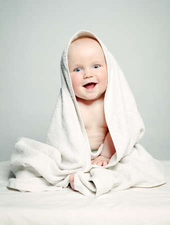 Cute Baby after Bath, Parental Care Concept. Happy Baby having Funの写真素材
