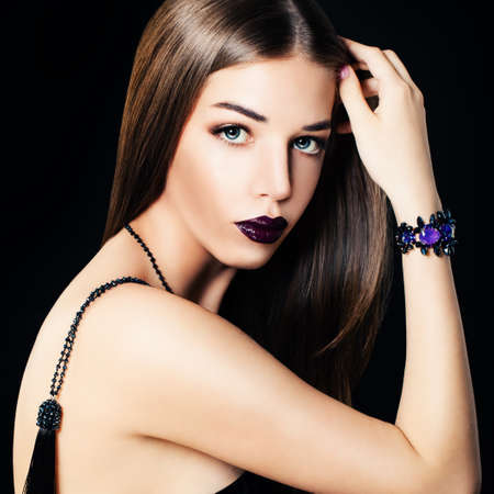 Glamorous Woman Fashion Model with Trendy Jewelry, Necklace and Purple Bracelet. Closeup Fashion Portraitの写真素材