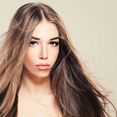 Pretty Young Woman with Perfect Skin and Long Healthy Hair. Beautiful Woman, Skin and Hair Care Conceptの写真素材