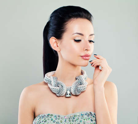 Fashion Portrait of Beautiful Woman Model in Silver Clothの写真素材