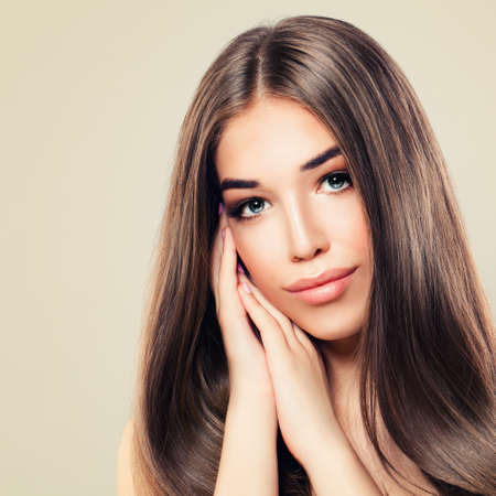 Beautiful Model with Perfect Skin and Long Healthy Hair. Cute Woman, Skin and Hair Care Conceptの写真素材