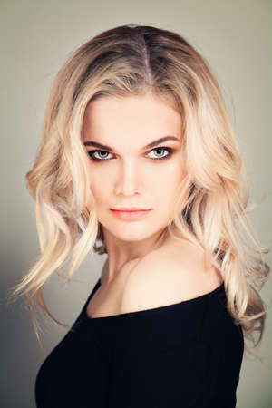 Fashion Woman with Blonde Curly Hairstyleの写真素材