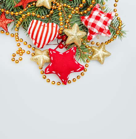 Christmas Background with Xmas Tree Twig, Glitter Golden Stars, Garland and Xmas Decorの写真素材