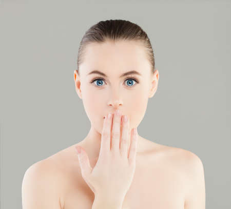 Beautiful Young Surprised Woman Spa Model with Healthy Skinの写真素材