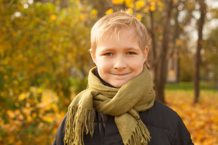 Cute Child Outdoors. Happy Little Boy in Autumn Parkの写真素材