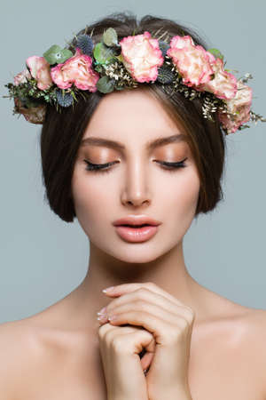 Healthy Woman Spa Model with Spring Flowers and Fresh Skin, Young Female Face Closeupの写真素材