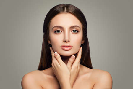 Young Healthy Woman, Skincare Concept. Clear Skin and Hands with French Manicureの写真素材