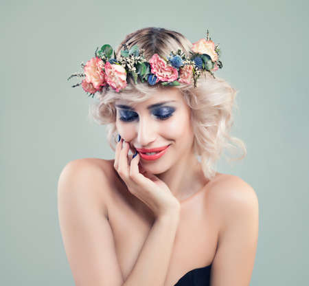 Beautiful Smiling Woman Fashion Model with Blue Eyeshadow Makeup, Pink Roses Flowers and Blonde Bob Hairstyleの写真素材