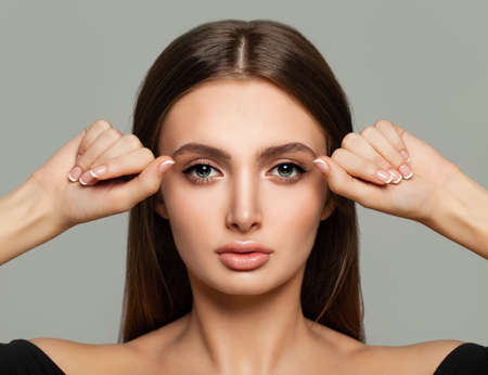 Young Beauty. Spa Portrait of Healthy Woman. Clear Skin and Hands with French Manicureの写真素材