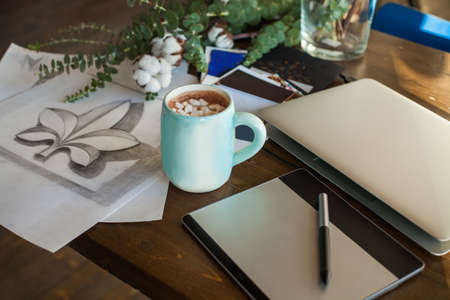 Creative Workplace Background with Drawing, Laptop and Coffee Cup, Graphic Tablet