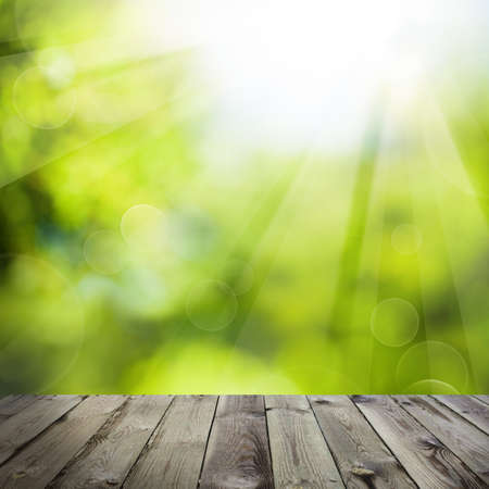 Abstract Green Background with Empty Wooden Table and Green Bokeh Sparkleの写真素材