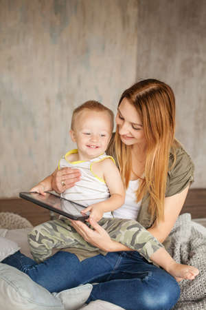 Mummy and Child Having Fun with Digital Tabletの写真素材