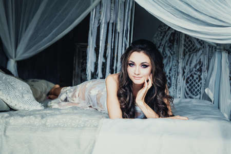 Perfect Woman Dreaming in White Vintage Interior Backgroundの写真素材