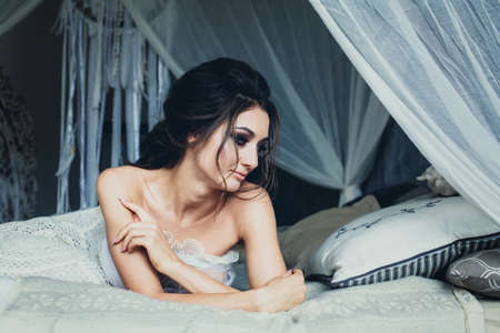 Romantic Young Woman with Wedding Hair and Bridal Makeupの写真素材
