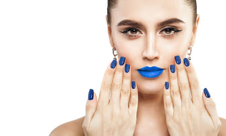 Female Face with Makeup Isolated on White Background. Blue Lips and Nails Closeup. Beauty Conceptの写真素材