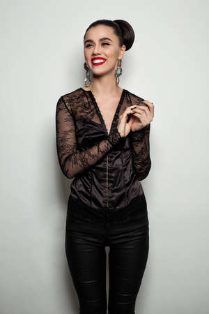 Happy Woman against Gray Wall Background. Girl Laughingの写真素材