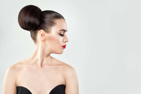 Beautiful Woman with Hair Updo on Background Copy space, Profile Portraitの写真素材