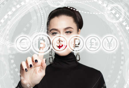Business woman with Bitcoin symbol. Blockchain Transfers Concept on Gray Backgroundの写真素材