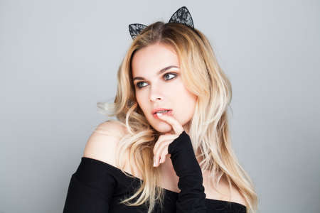 Fashion Photo of Alluring Female Model with Black Lacy Cat Earsの写真素材