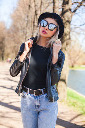 Attractive Female Model Woman in Sunglasses, Black Hat and Jacket, Outdoors Fashion Portraitの写真素材