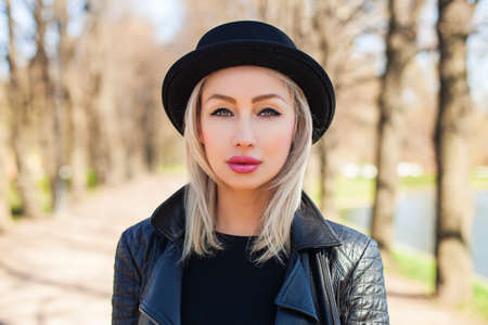 Closeup Female Face. Cute Blonde Woman Outdoorsの写真素材