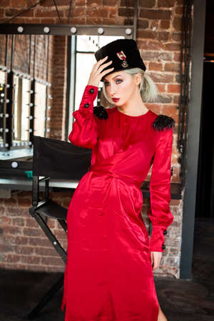 Perfect fashion model woman in red silky dress, portraitの写真素材