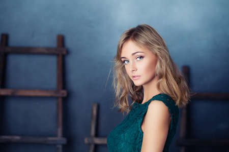 Nice fashion model woman on rustic backgroundの写真素材