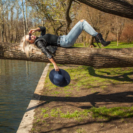 Perfect Woman Fashion Model Relaxing in Outdoorsの写真素材