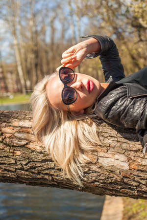 Closeup Portrait of Cute Woman Relaxing in Outdoorsの写真素材