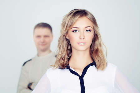 Beautiful young woman on grey backgroundの写真素材