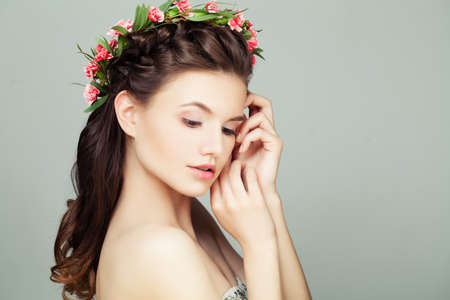 Cute Woman with Long Healthy Hair on Grey Background, Portraitの写真素材