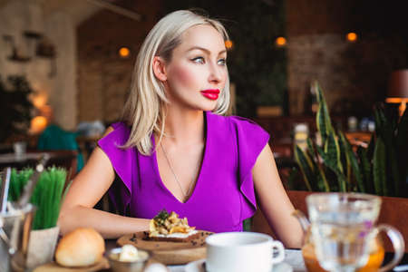 Attractive Woman dinning in Restaurantの写真素材