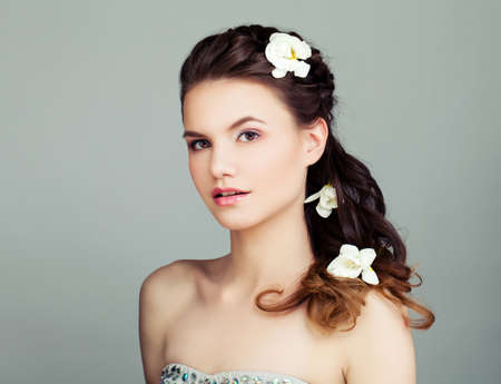 Young woman with prom hairstyle. Beautiful female face