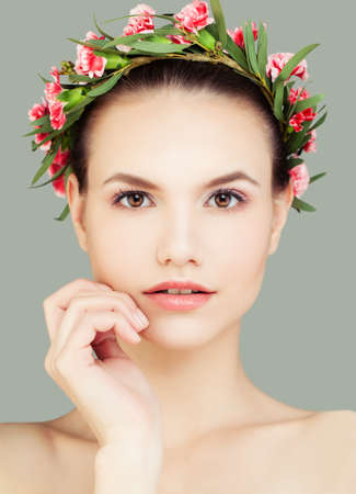Young Cute Woman Spa Model with Healthy Skin and Flowersの写真素材