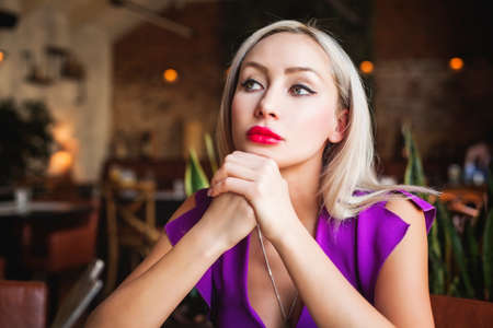 Portrait of Cute Woman in Restaurantの写真素材