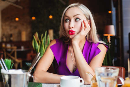 Cute Woman chatting in Restaurantの写真素材